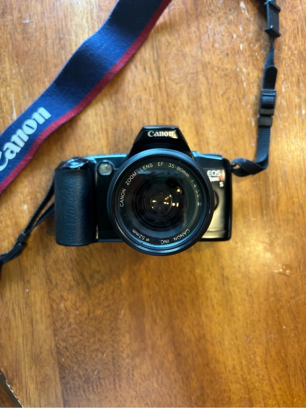Canon Rebel X Black DSLR Camera with Navy and Red Strap